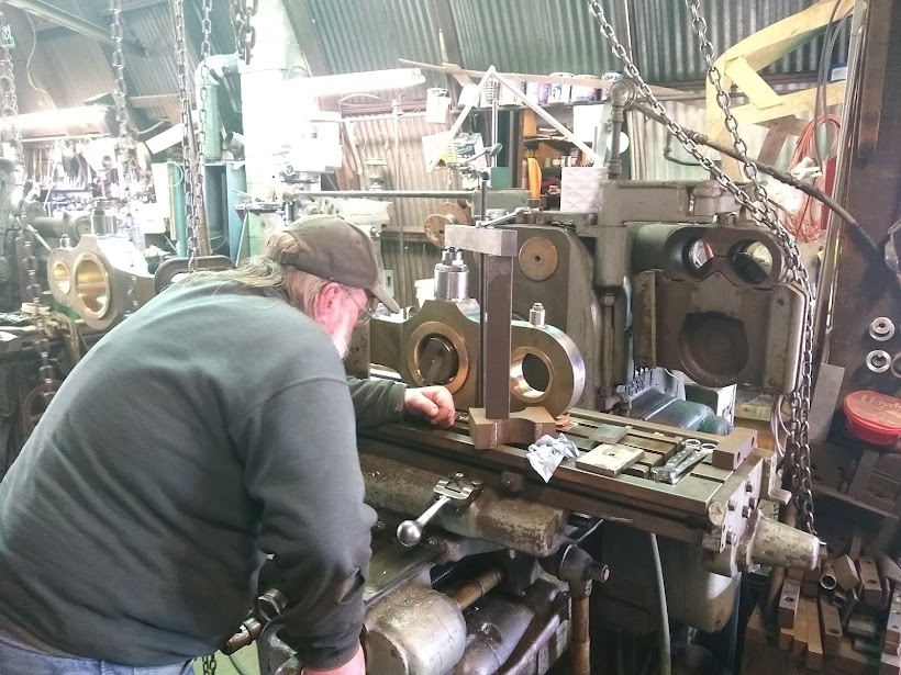 Truing up the connecting rods.